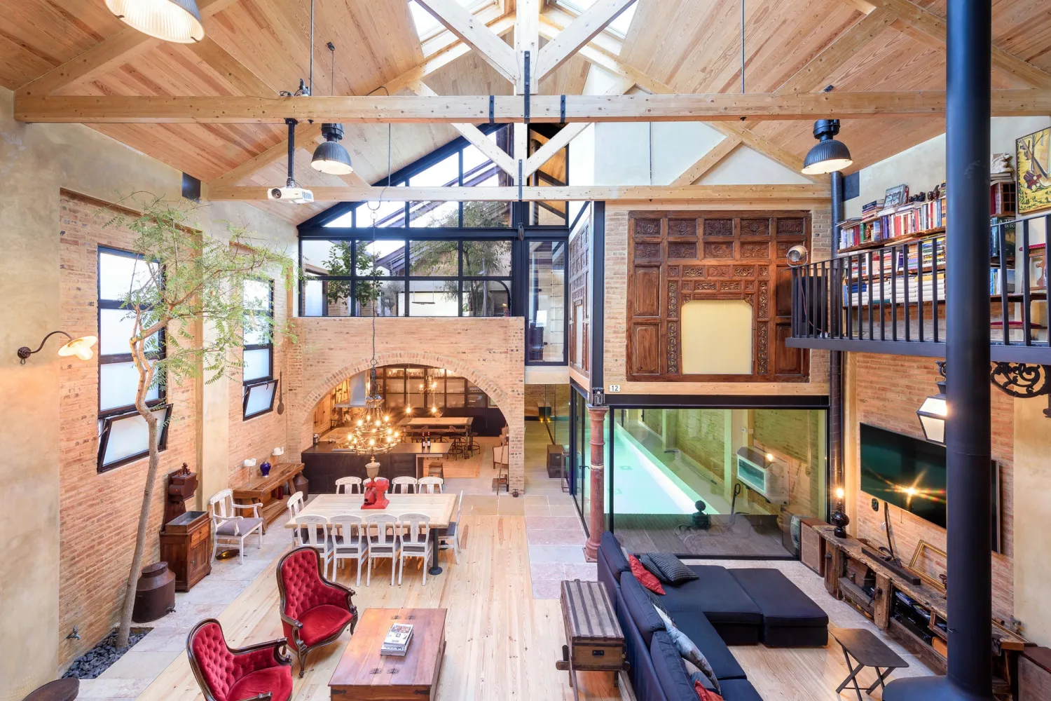 This 5,700-square-foot, loft-style house in the residential Penha de Franca section of Lisbon, Portugal, is on the market for $2.2 million. The home has three bedrooms, a mezzanine library accessible by ladder and an indoor lap pool. - João Peleteiro - NYT