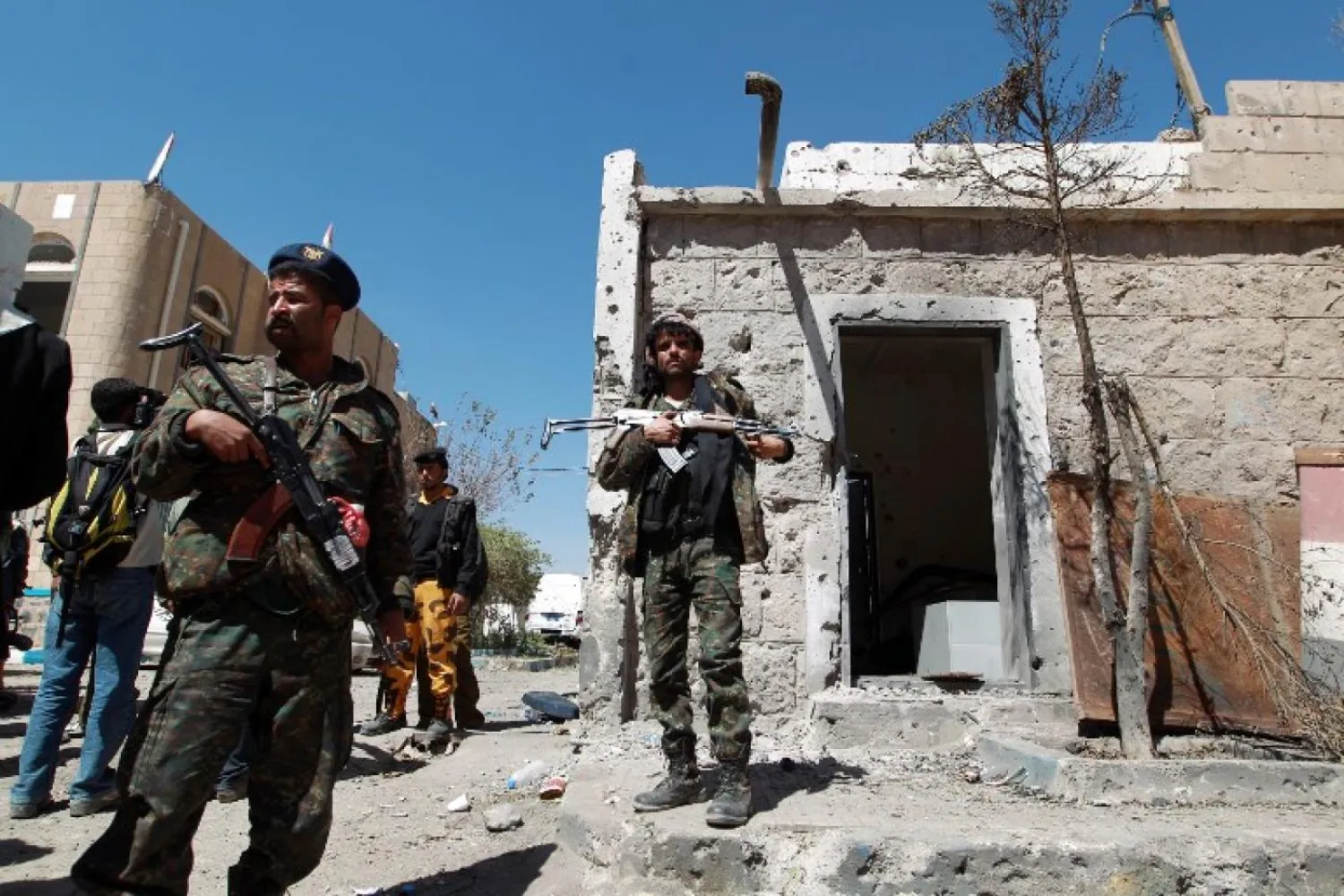 Yemeni policemen stand guard outside the central prison in Sanaa (AFP)
