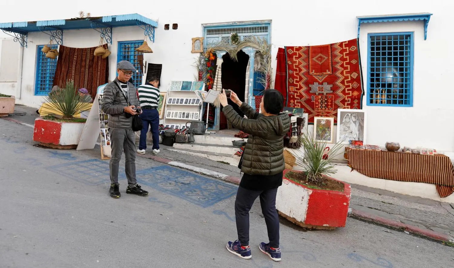 A tourist poses for a picture in Sidi Bou Said, an attractive tourist destination near Tunis, Tunisia January 7, 2019. (Reuters)