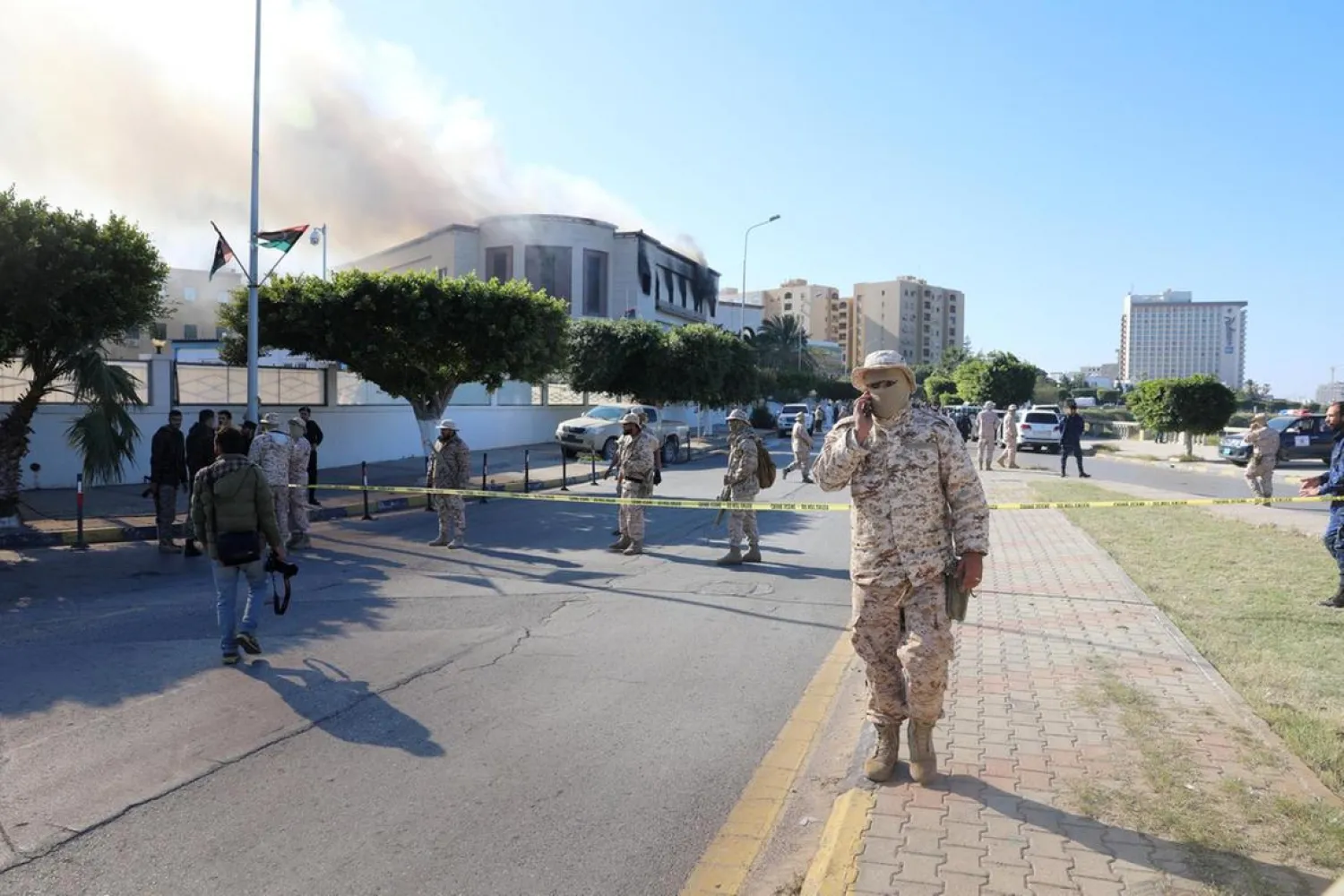 Security forces stand at the site of the headquarters of Libya's foreign ministry after ISIS suicide attackers hit in Tripoli, Libya. (Reuters)