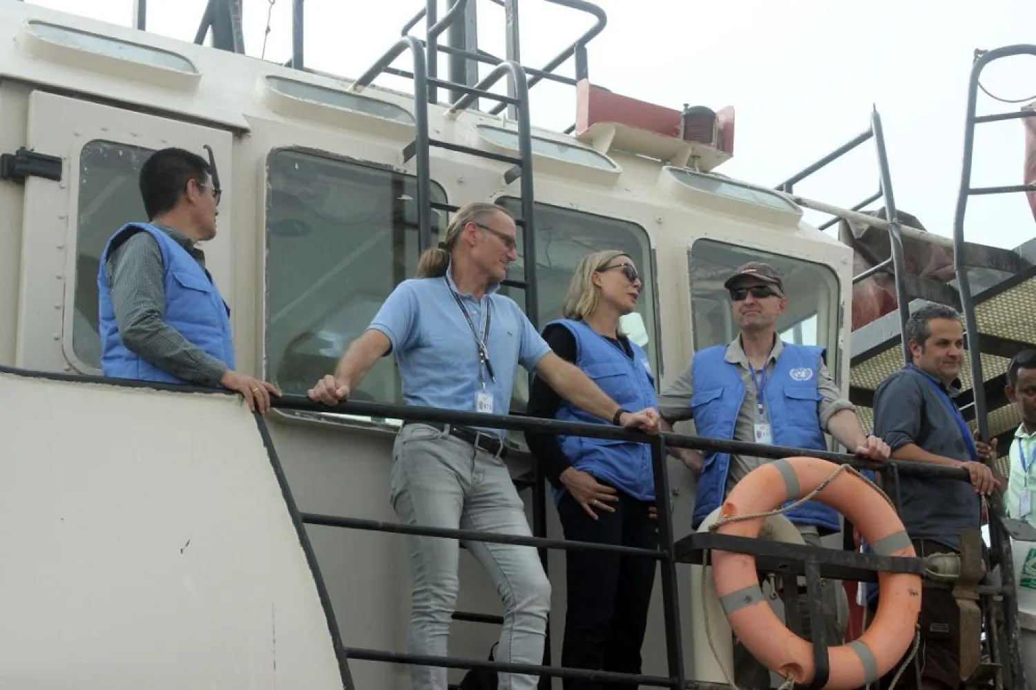 Representatives of the UN Redeployment Coordination Committee attend a joint meeting with representatives of the Yemeni government and the Houthis on a vessel off the coast on Sunday. (AFP)