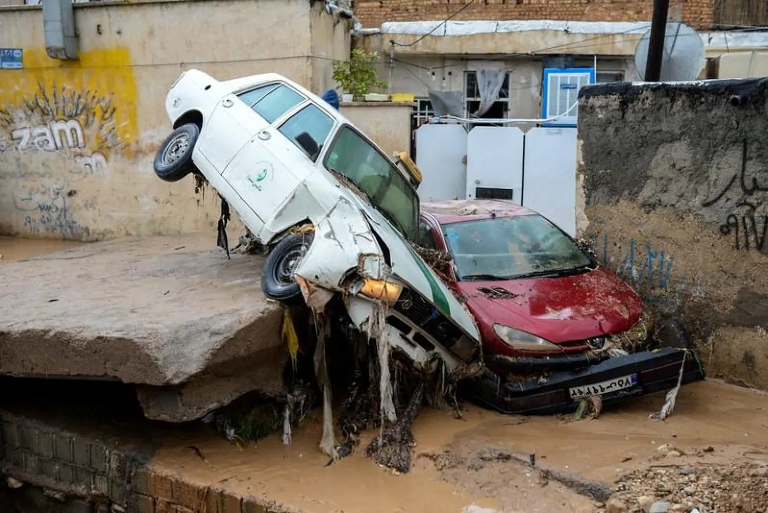 FILE PHOTO: Damaged vehicles are seen after a flash flooding in Shiraz, Iran, March 26, 2019. Tasnim News Agency/via REUTERS
