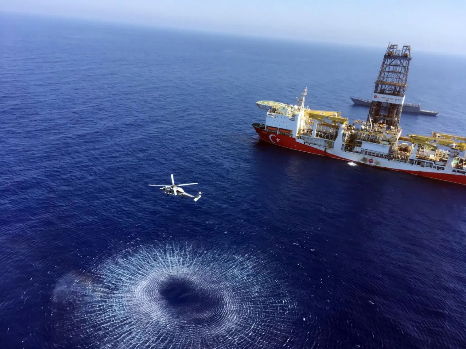 In this Tuesday, July 9, 2019 photo, a helicopter flies near Turkey's drilling ship, Fatih, dispatched towards the eastern Mediterranean, near Cyprus. (AP)