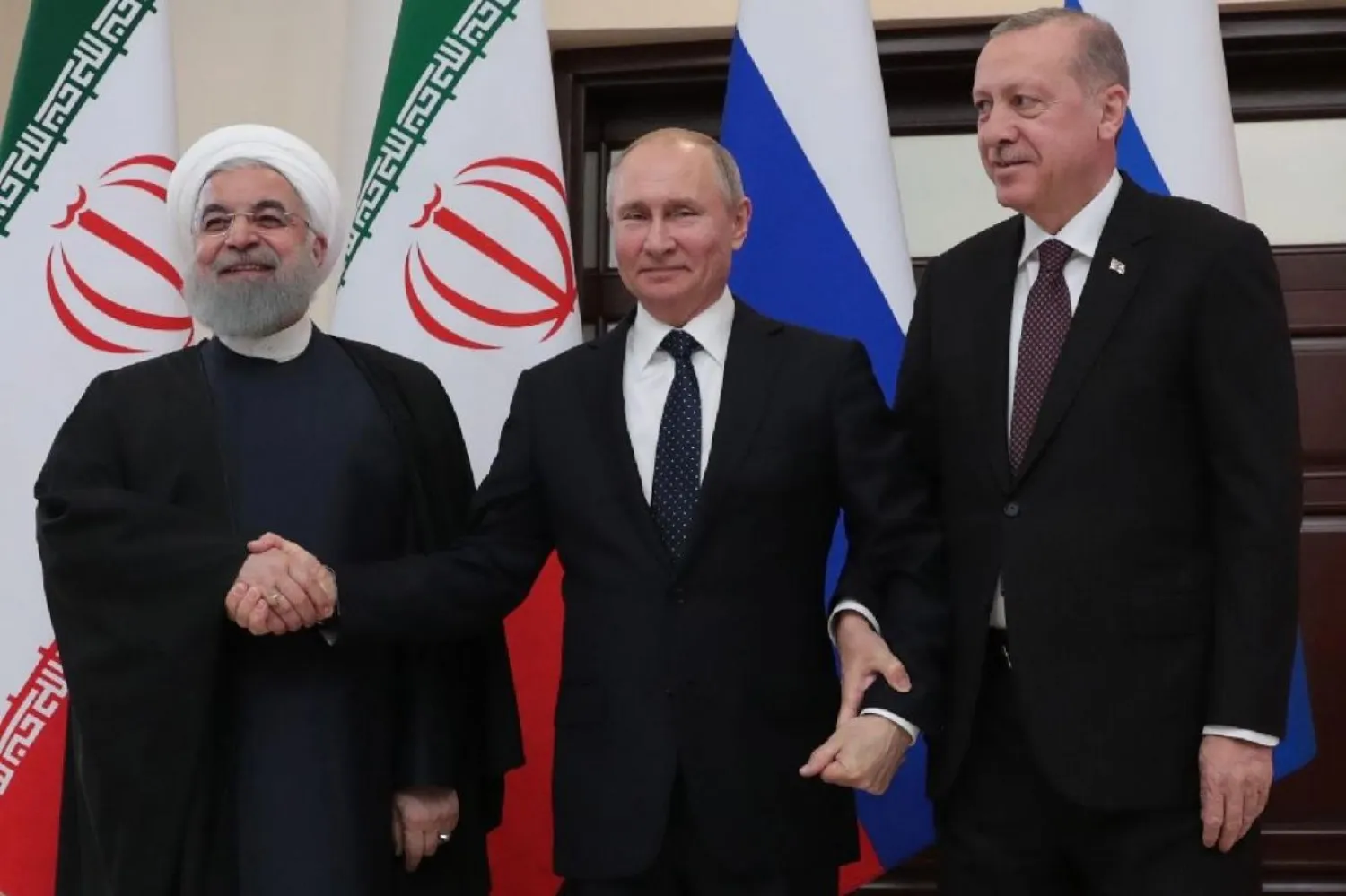 İran Cumhurbaşkanı Hasan Ruhani, Rusya Devlet Başkanı Vladimir Putin ve Türkiye Cumhurbaşkanı Recep Tayyip Erdoğan (AFP)