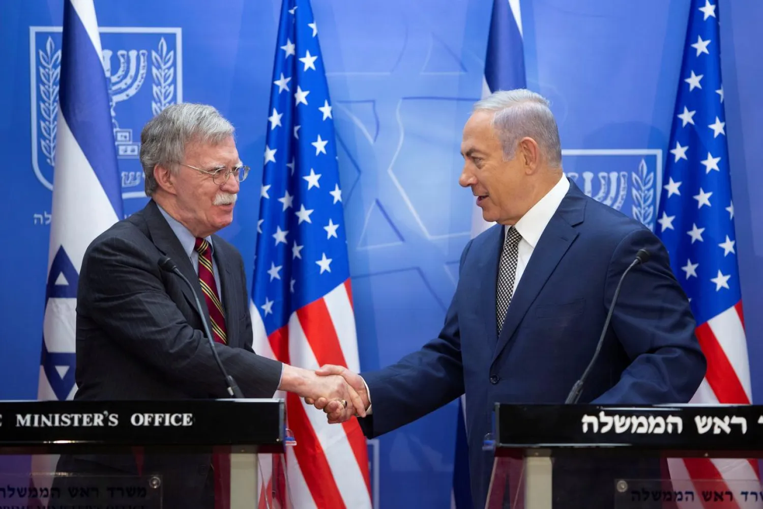  Israeli Prime Minister Benjamin Netanyahu shakes hands with US National Security Advisor John Bolton during their meeting in Jerusalem, August 20, 2018. (Sebastian Scheiner /Pool via Reuters)

 