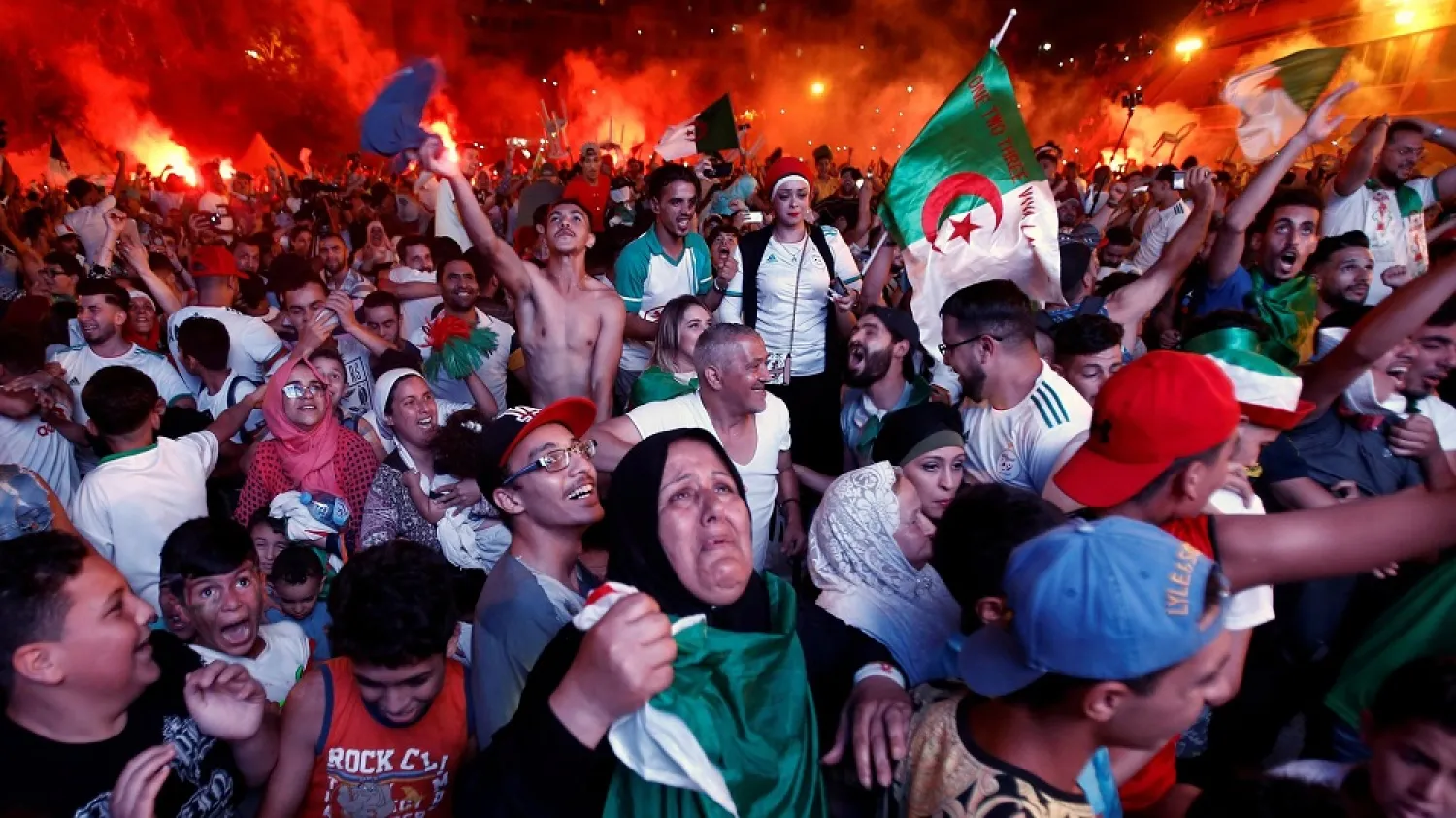 Supporters in Algiers react after Algeria won the semi-final against Nigeria 2-1 in the Africa Cup of Nations tournament in Cairo on Sunday. (Reuters)