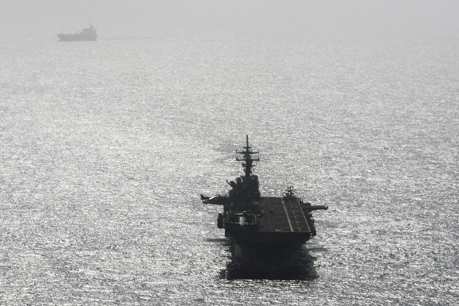 The USS Boxer ship sails near a tanker in the Arabian Sea off Oman July 17, 2019. (Reuters)