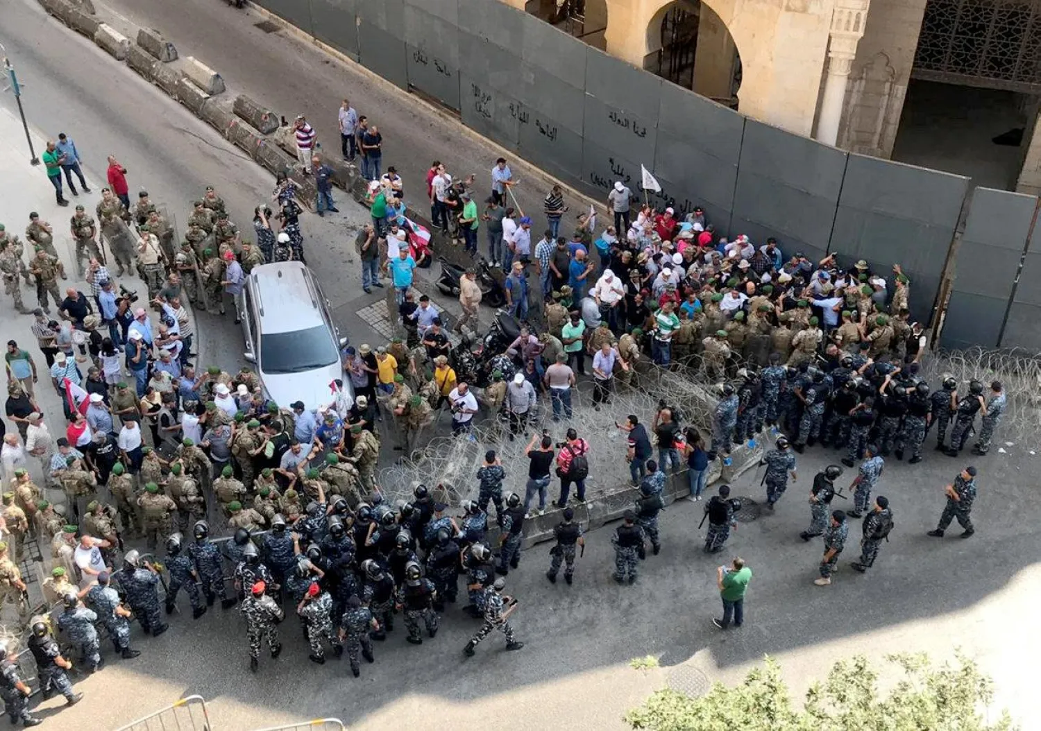 Veterans tussle with the Lebanese army and police during a protest over cuts to their pension service at downtown Beirut, Lebanon July 19, 2019. (Reuters)