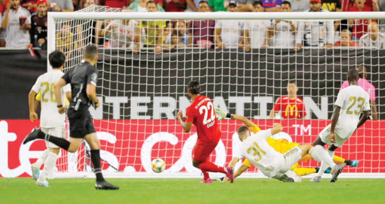 غنابري لاعب البايرن (في الوسط) يسجل في مرمى الريـال ثالث أهداف فريقه (أ.ف.ب)