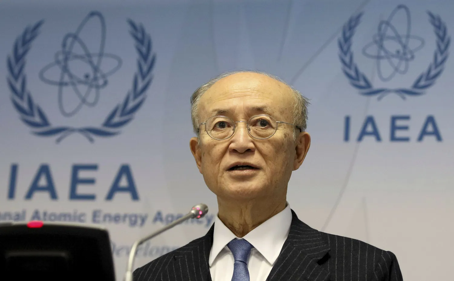 FILE - In this Nov. 22, 2018, file photo, International Atomic Energy Agency (IAEA) Director General Yukiya Amano of Japan addresses the media during a news conference after a meeting of the IAEA board of governors at the International Center in Vienna, Austria. (AP Photo/Ronald Zak)