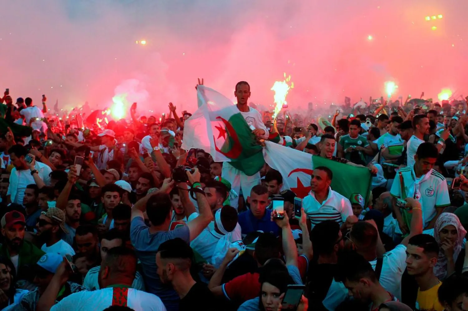 Algerian fans celebrate in Algiers after their team won the 2019 Africa Cup of Nations final against Senegal. (AFP)