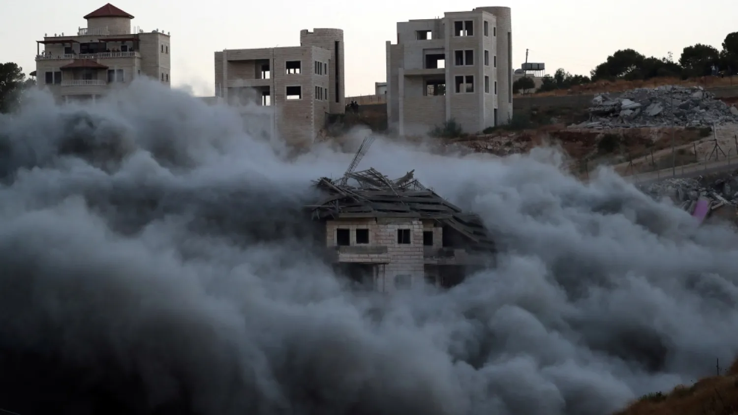 The demolition of a Palestinian building by Israeli forces in the village of Sur Baher on July 22, 2019. (Reuters)