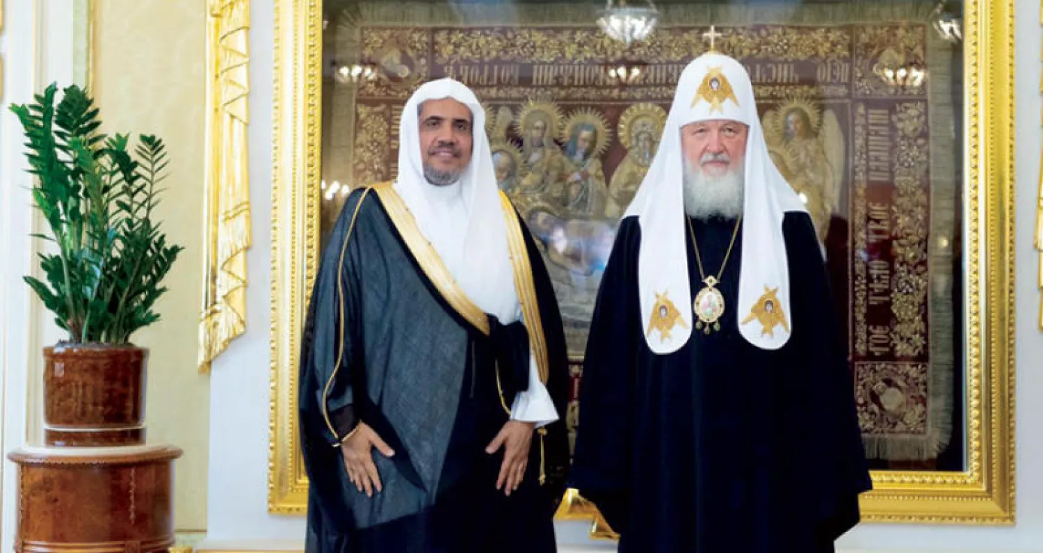 د. العيسى خلال لقائه كيريل الأول بطريرك موسكو وسائر روسيا (الشرق الأوسط)