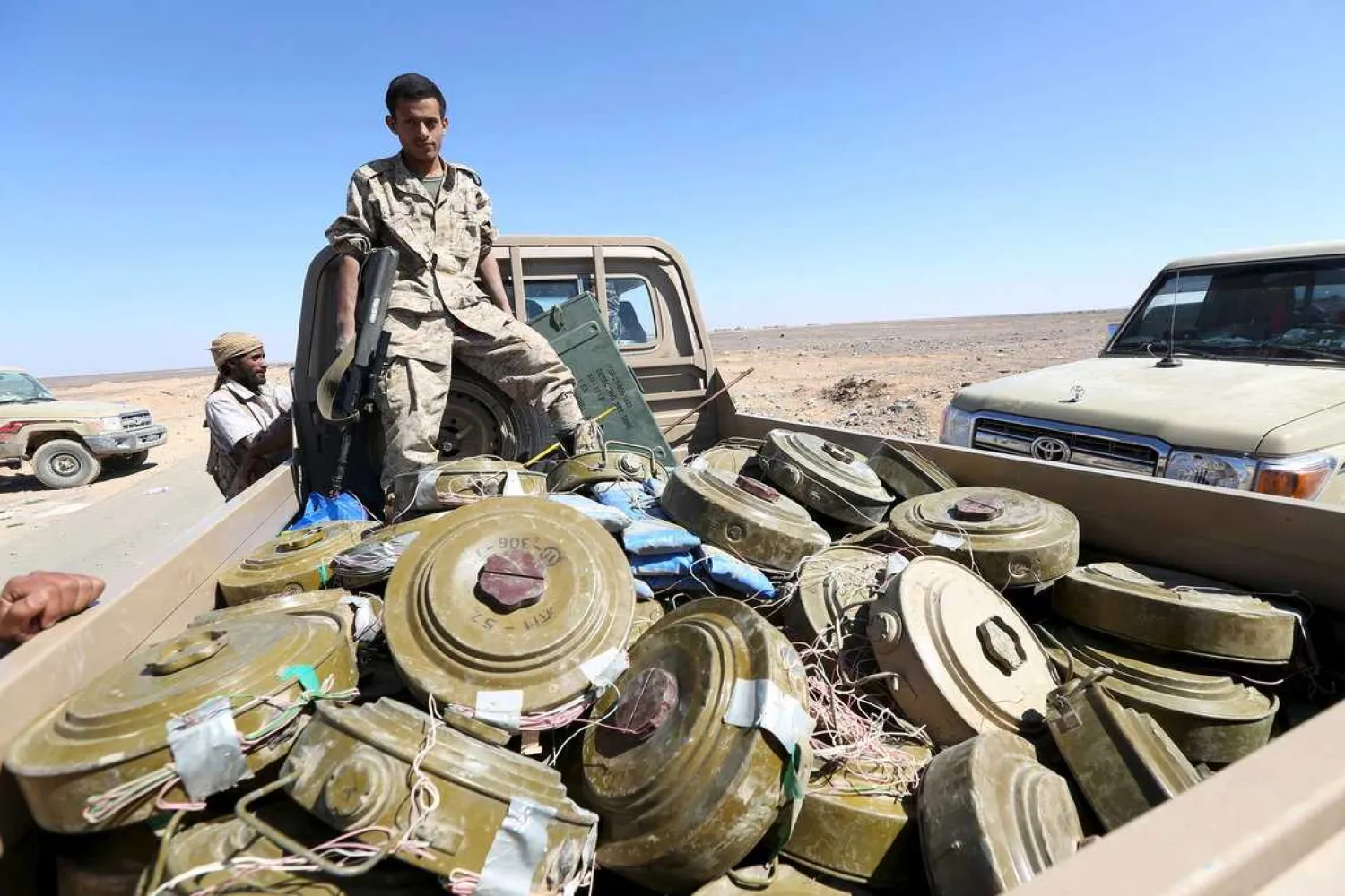A Yemeni government soldier stands on a truck transporting land mines left by the Houthis in al-Jadaan area, in the country's central province of Maarib, December 21, 2015. Reuters