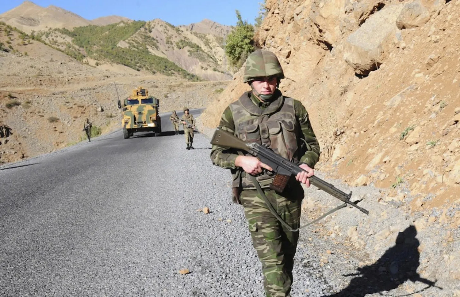 Turkish soldiers patrol a road near Cukurca in the Hakkari province, southeastern Turkey, near the Turkish-Iraqi border. (Reuters)