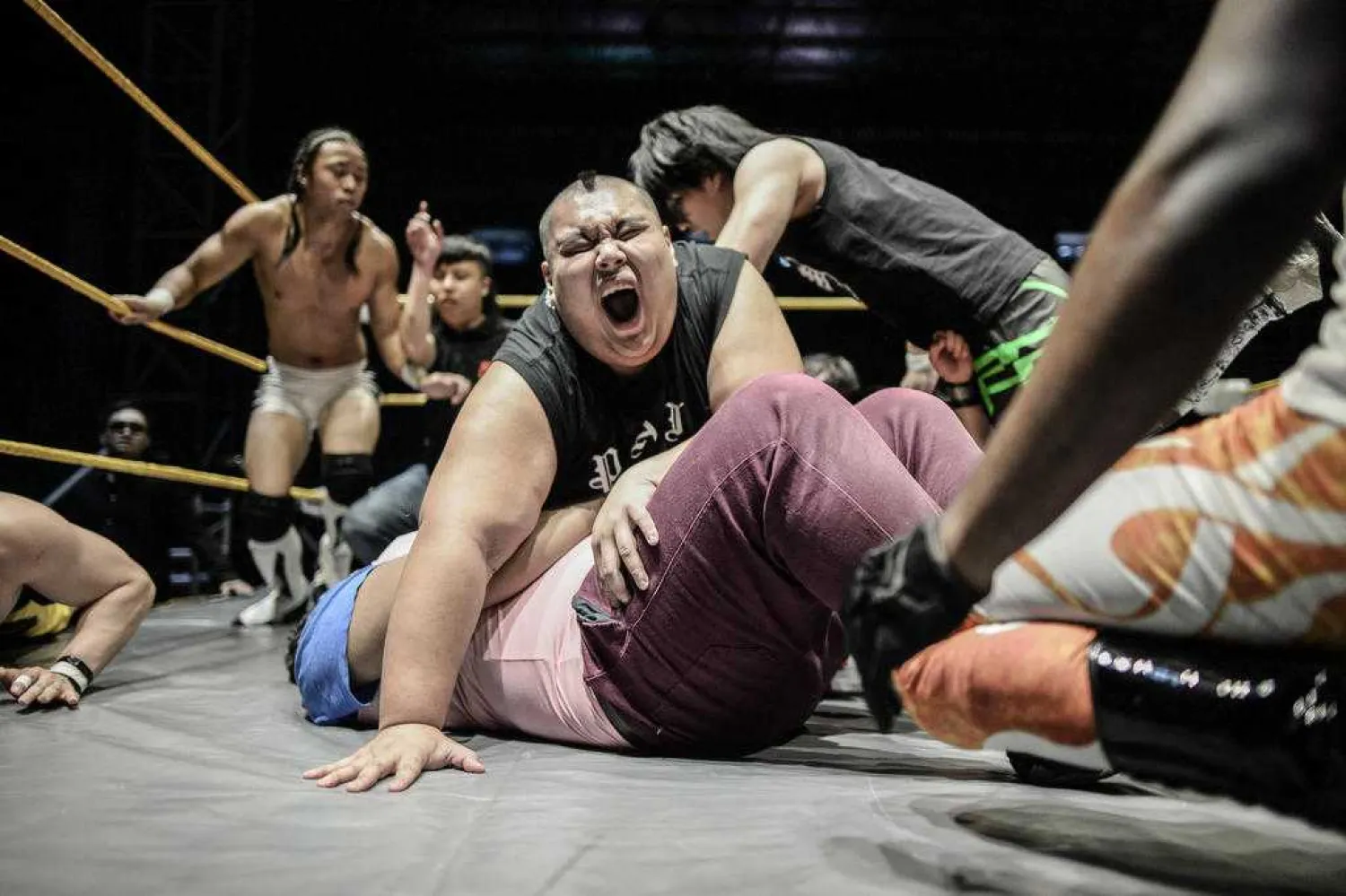 This picture taken on May 21, 2016 shows professional wrestlers fighting each other during the Wrestling City Asia organized by Singapore Pro Wrestling at a stadium in Kuala Lumpur. Photo: AFP