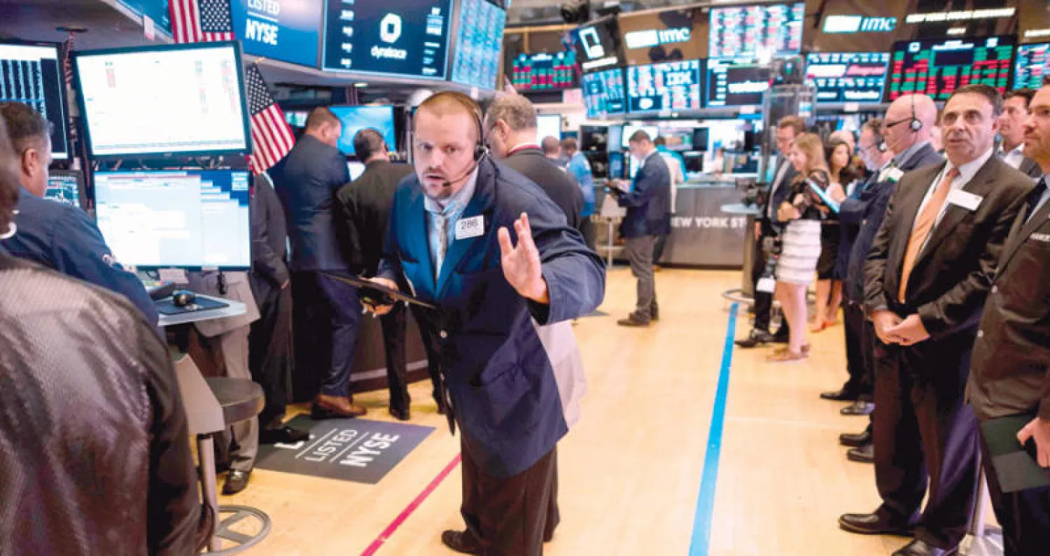 مضاربون في سوق نيويورك أمس (أ.ف.ب)