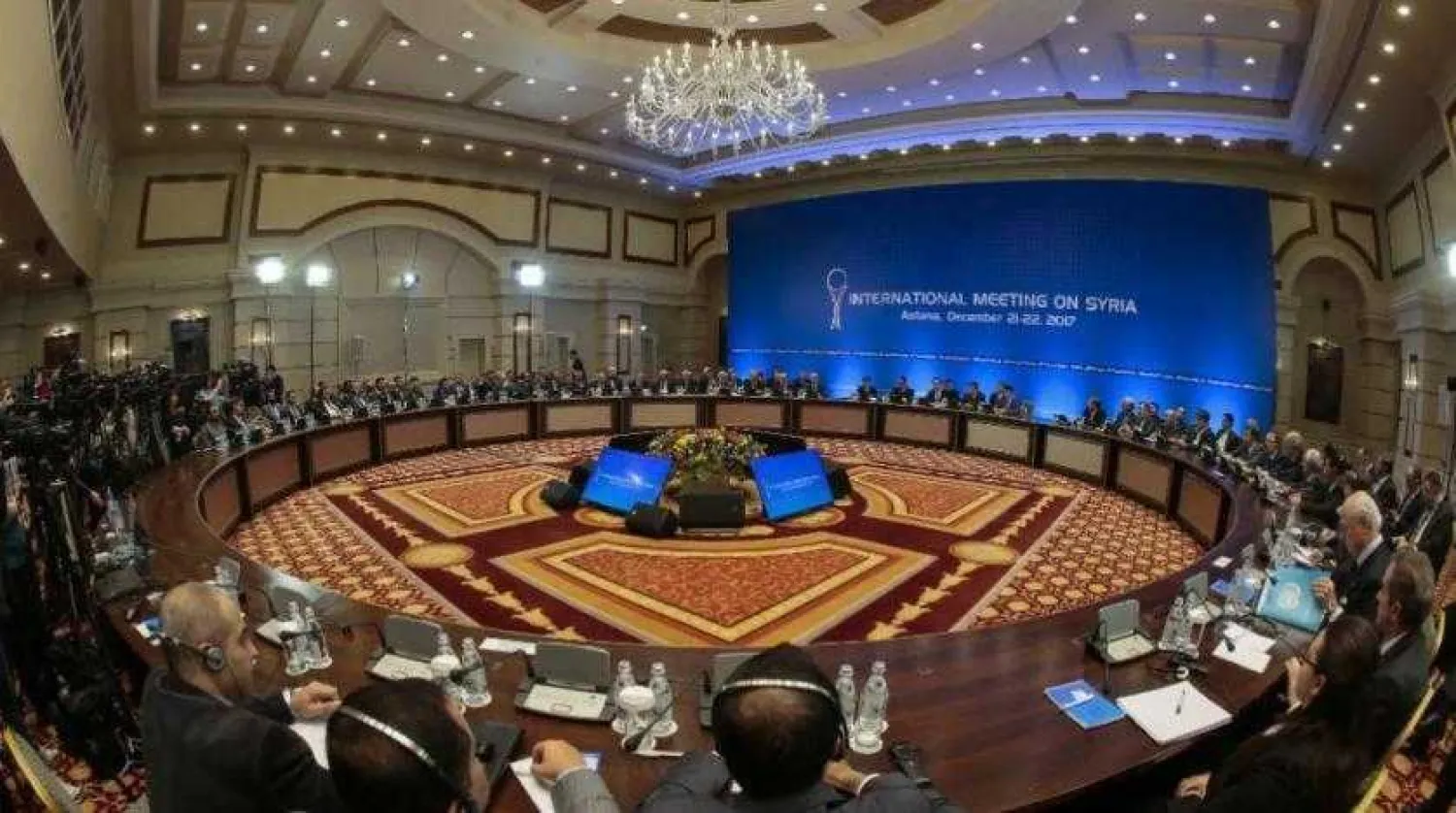 Syrian regime representatives and opposition delegates along with other attendees take part in Syria peace talks in Astana on December 22, 2017. AFP file photo