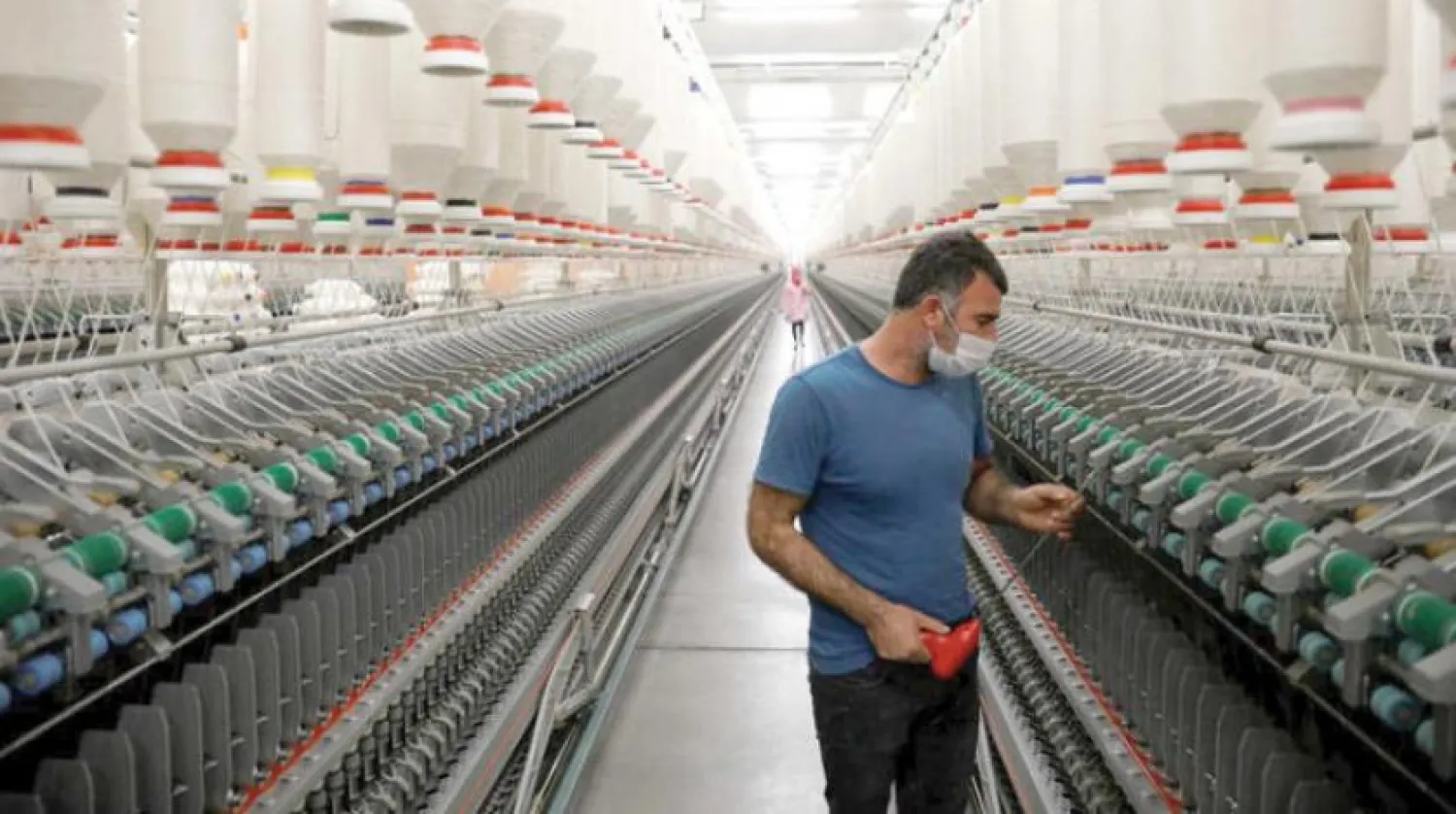 A worker checks textile machines in the southern Turkish city of Diyarbakir (Reuters)