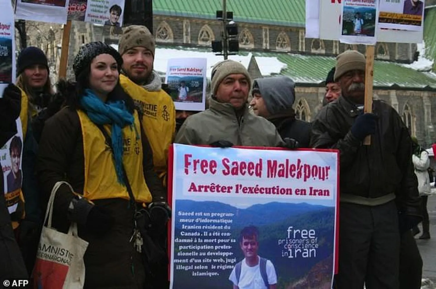 AFP: This January 22, 2012 photo shows supporters demonstrating for the release of Saeed Malekpour in Montreal, Canada.

