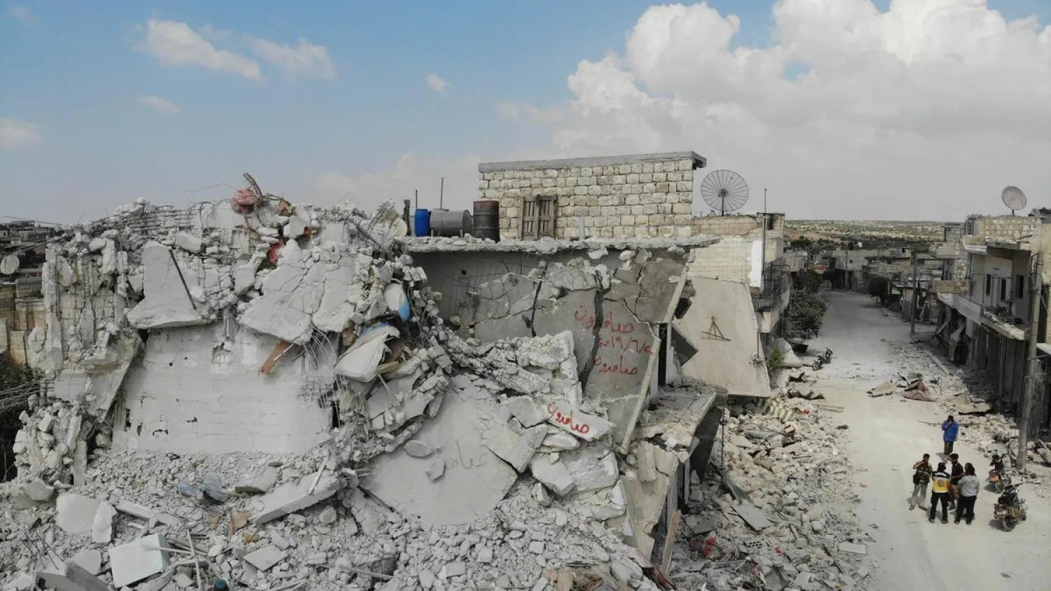 Damaged and destroyed buildings in the town of Ihsim, in Syria’s Idlib region. (AFP)