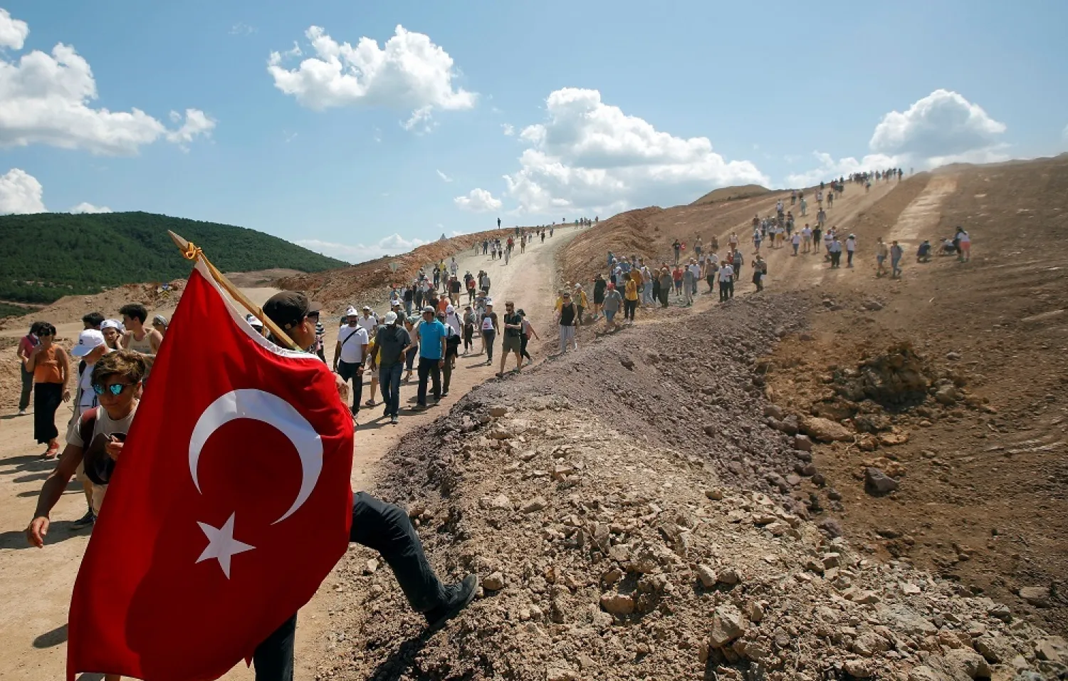 Environmental activists take part in a march to protest against what they say will be pollution from a gold mine project near the town of Kirazli, Turkey, August 5, 2019. (Reuters)