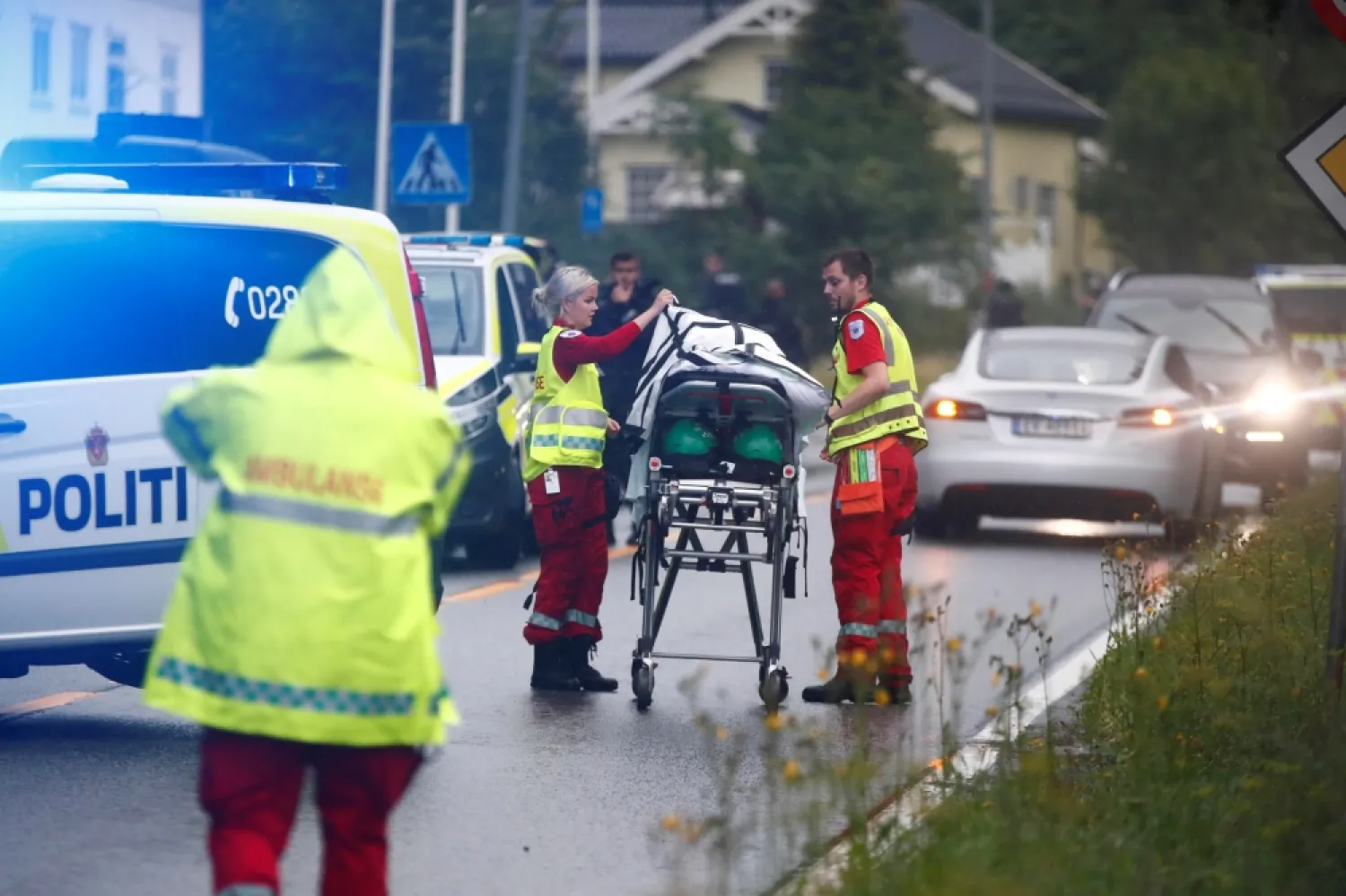 Emergency crews are seen near a stretcher after a shooting in al-Noor Islamic Center mosque, near Oslo, Norway on Saturday. (Reuters)