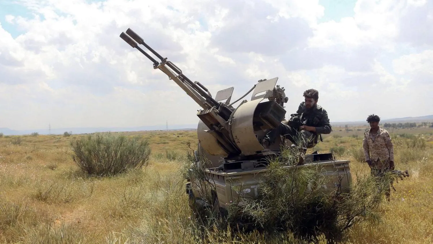 Fighters loyal to Libya’s GNA hold a position west of the city of Aziziah, some 60 kilometers southwest of the capital Tripoli. (AFP)