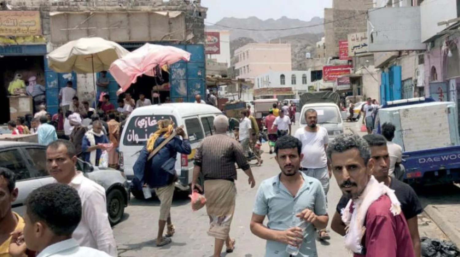 Yemenis walk in a street market in Aden on August 11, 2019. Nabil HASAN / AFP
