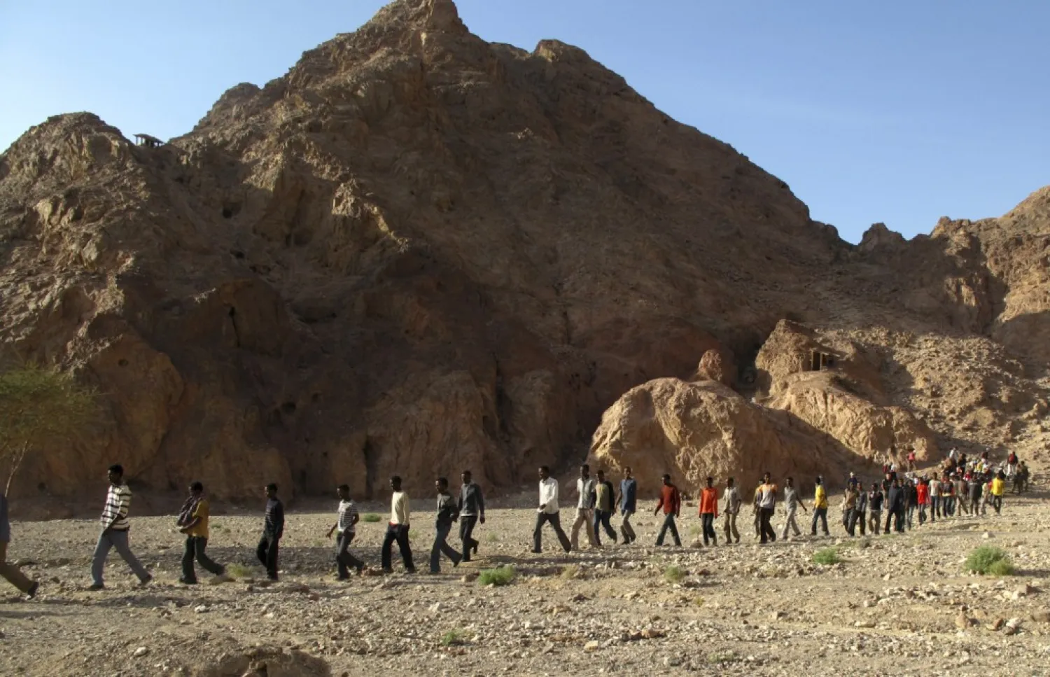 Dozens of African migrants. (AP file photo)