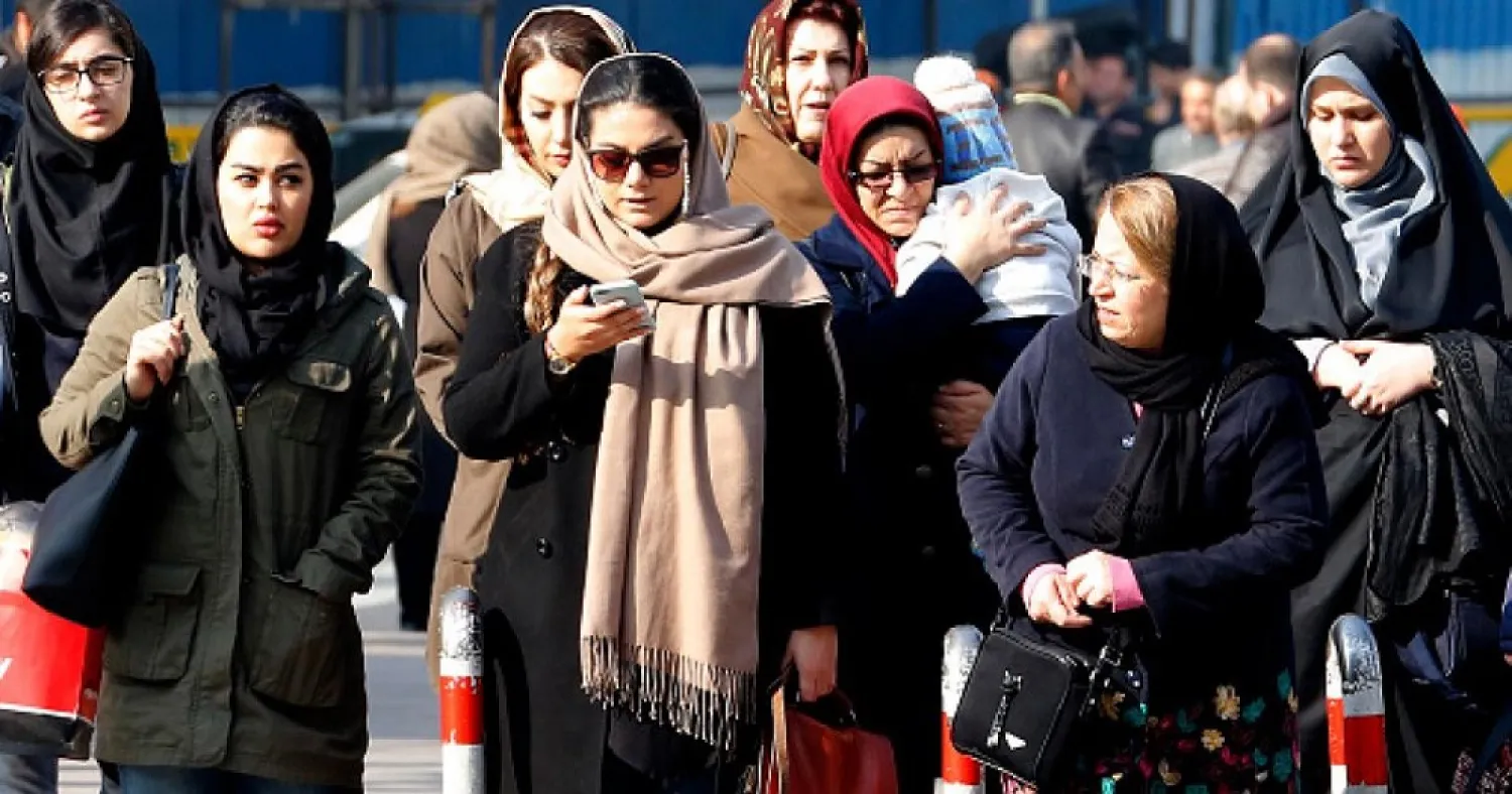 Iranian women wearing hijab walk down a street in the capital Tehran on February 7, 2018. (Getty Images)