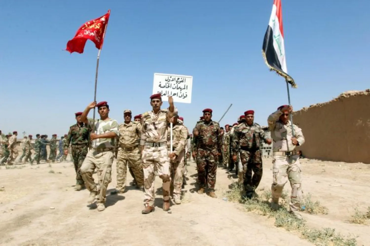 Popular Mobilisation Forces (PMF) march during a military parade in Daquq, nearby Kirkuk, Iraq August 5, 2017. REUTERS/Ako Rasheed