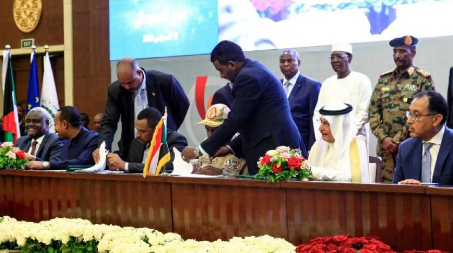 The agreement was signed by Mohamed Hamdan Daglo, deputy chief of the military council, and Ahmed al-Rabie, representing the Alliance for Freedom and Change. AFP Photos