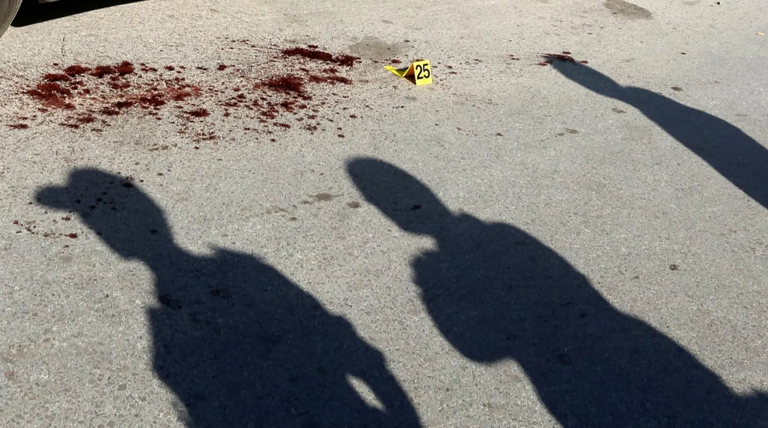 The shadow of police officers where a suspected militant was arrested after wounding two policemen in a knife attack near the parliament building in Tunis (File Photo: Reuters)

