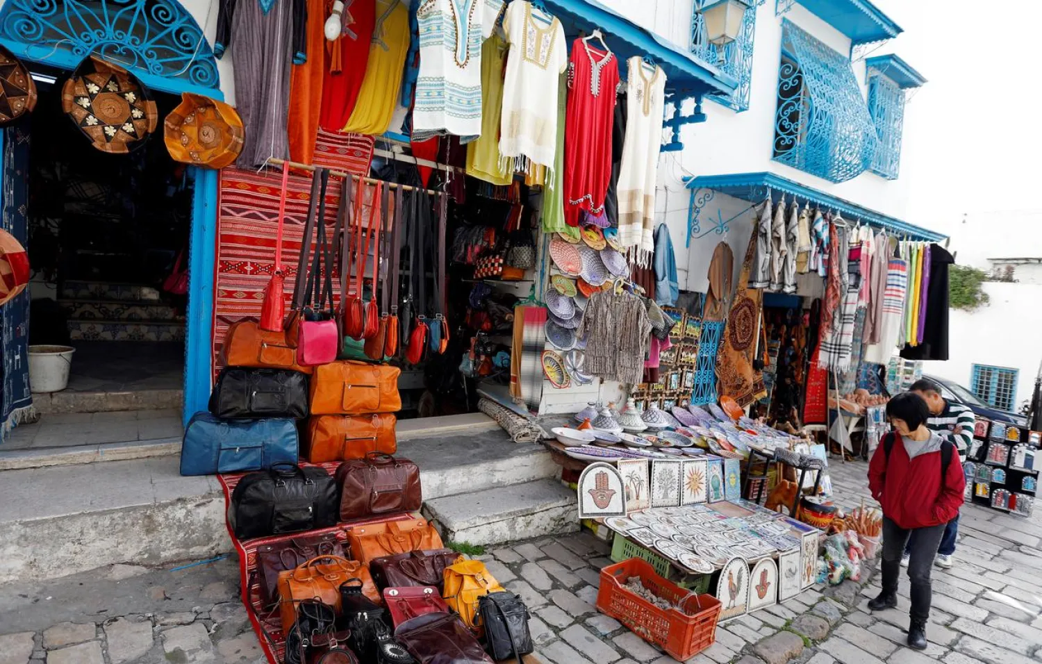 A tourist looks at traditional souvenirs displayed for sale in Sidi Bou Said, near Tunis, Tunisia January 7, 2019. (Reuters)