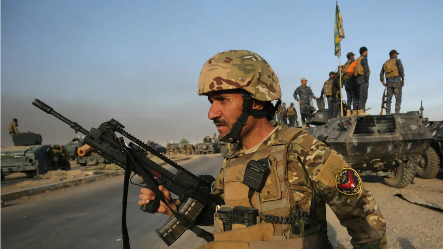 Several blasts hit a position held by Iraqi factions affiliated with the Popular Mobilization Forces (PMF) next to Balad air base north of Baghdad. (AFP)