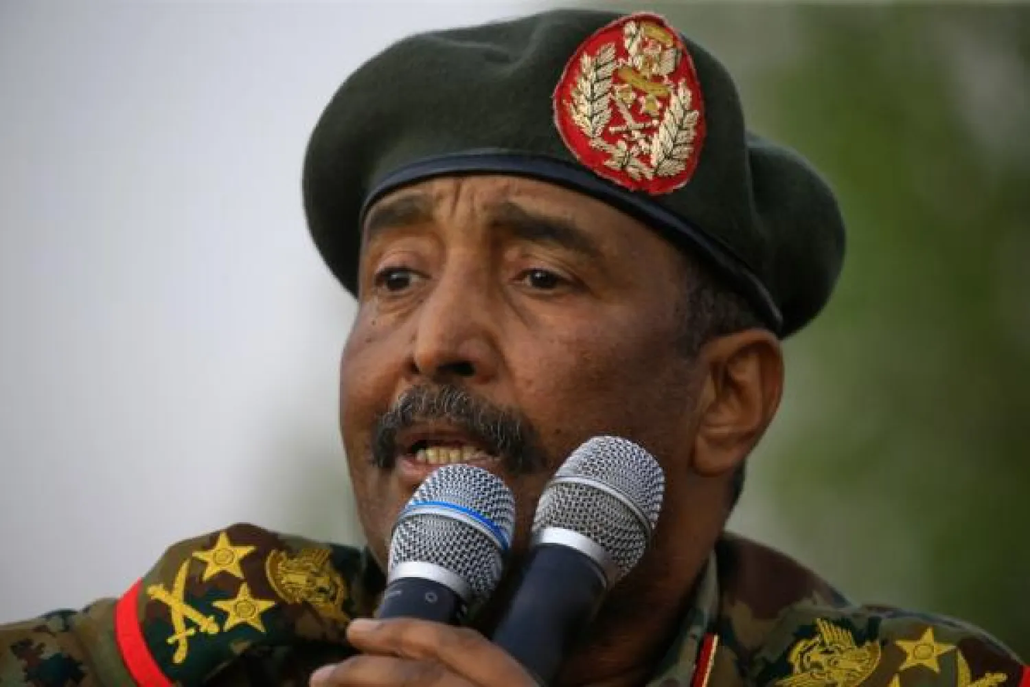 (FILES) In this file photo taken on June 29, 2019 General Abdel Fattah al-Burhan, the head of Sudan's ruling military council, addresses the crowd in Khartoum's twin city of Omdurman.  AFP