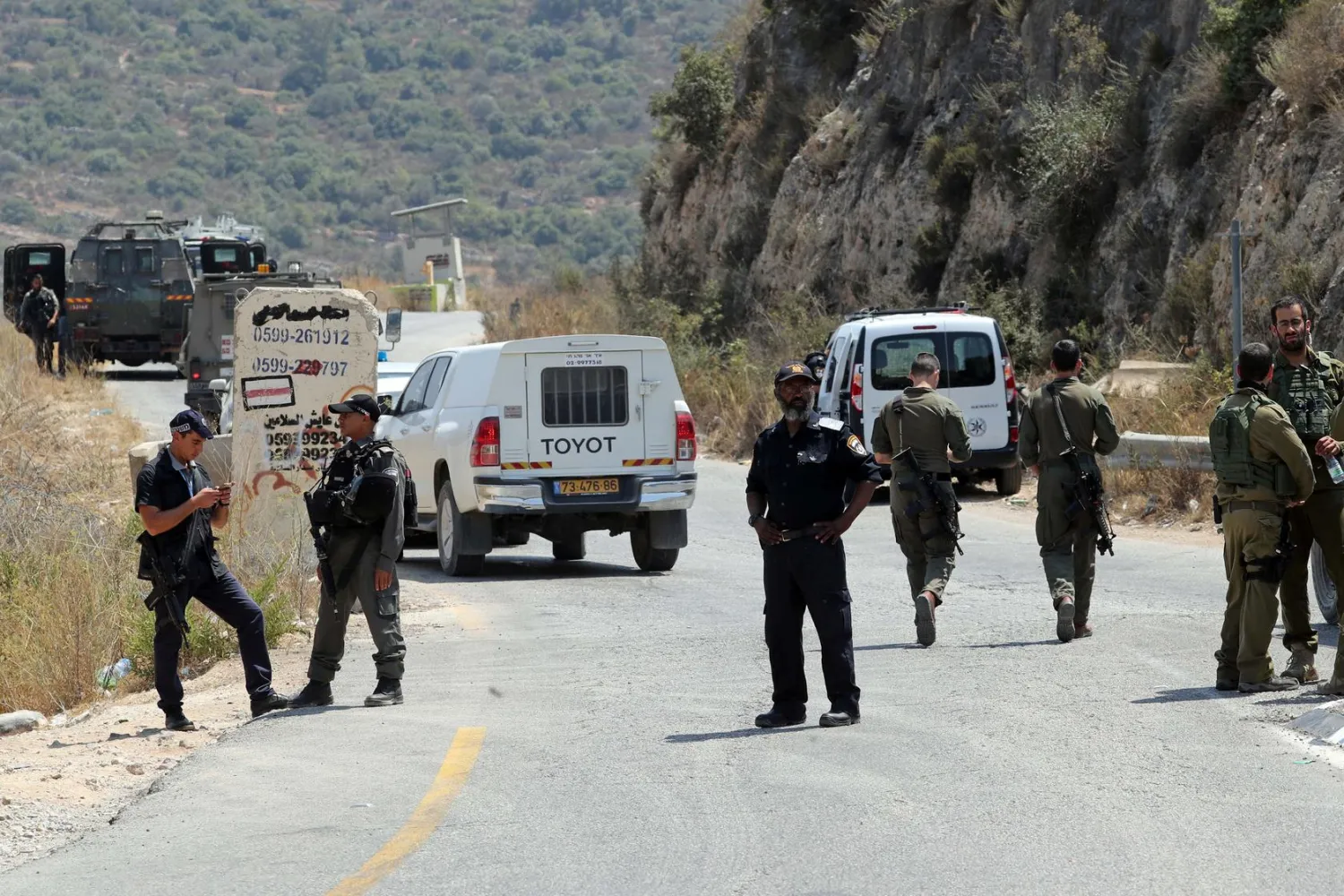 Israeli forces gather at the scene of an attack near the Jewish settlement of Dolev in the Israeli-occupied West Bank August 23, 2019. REUTERS/Ammar Awad