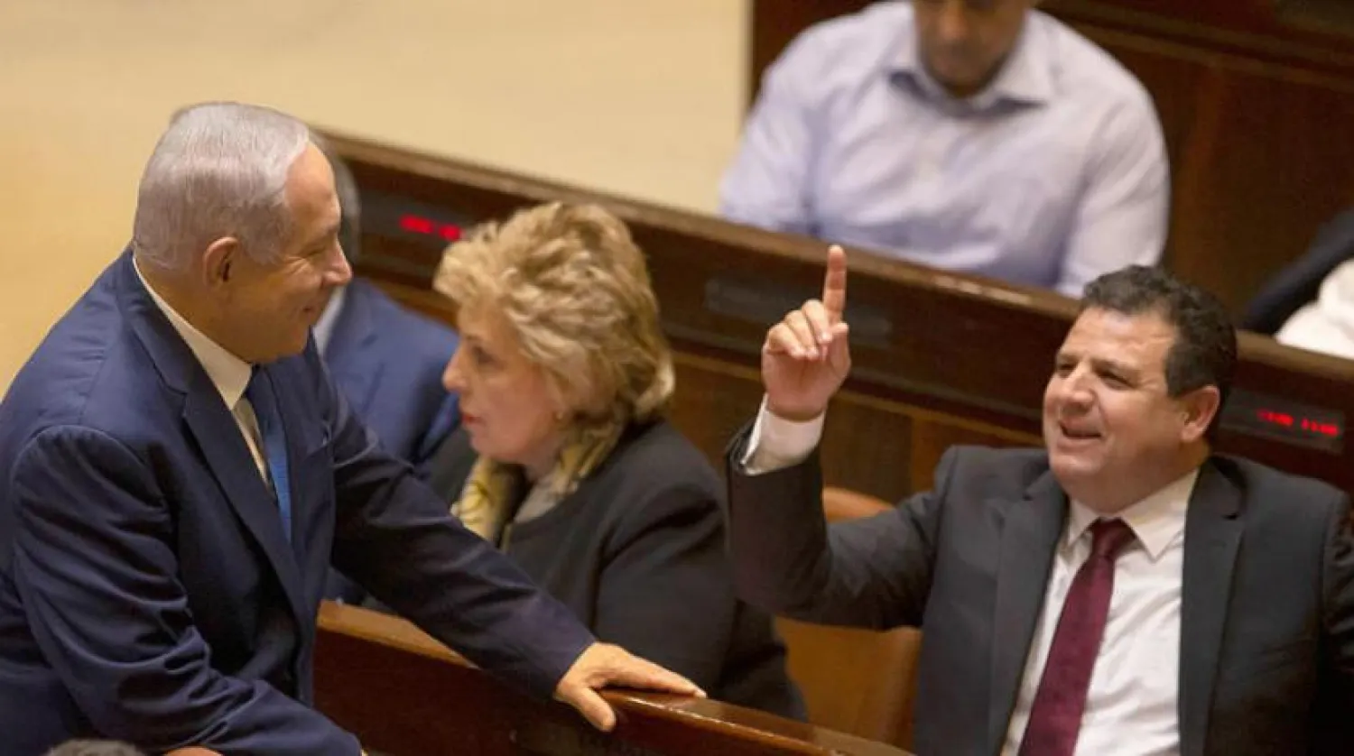 Side talks in the Knesset between Arab MP Ayman Odeh and Prime Minister Benjamin Netanyahu in December 2018 (AP)

