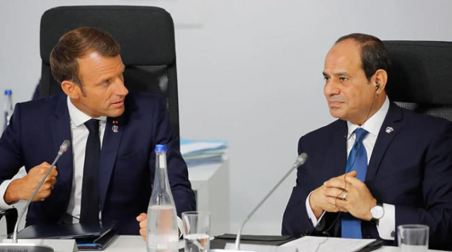 French President Emmanuel Macron talks with Egypt's President Abdel Fattah al-Sisi during a working session on "G7 Partnership with Africa" during the G7 summit in Biarritz, France, Sunday Aug. 25, 2019.(Philippe Wojazer/Pool via AP)