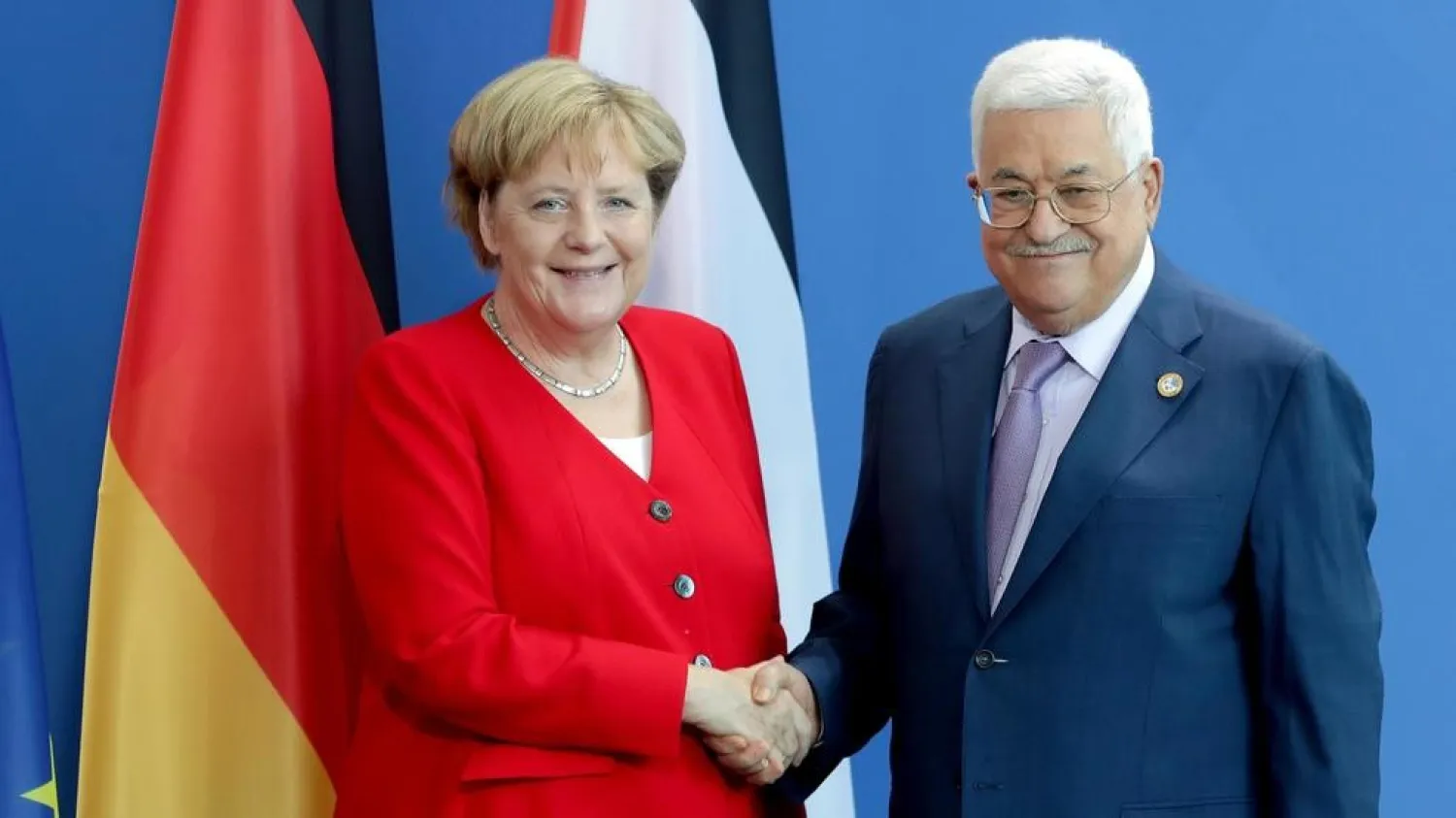 German Chancellor Angela Merkel, left, and Palestinian President Mahmoud Abbas, right, shake hands after a joint statement prior to a meeting at the Chancellery in Berlin, Germany, Thursday, Aug. 29, 2019. (AP Photo/Michael Sohn)