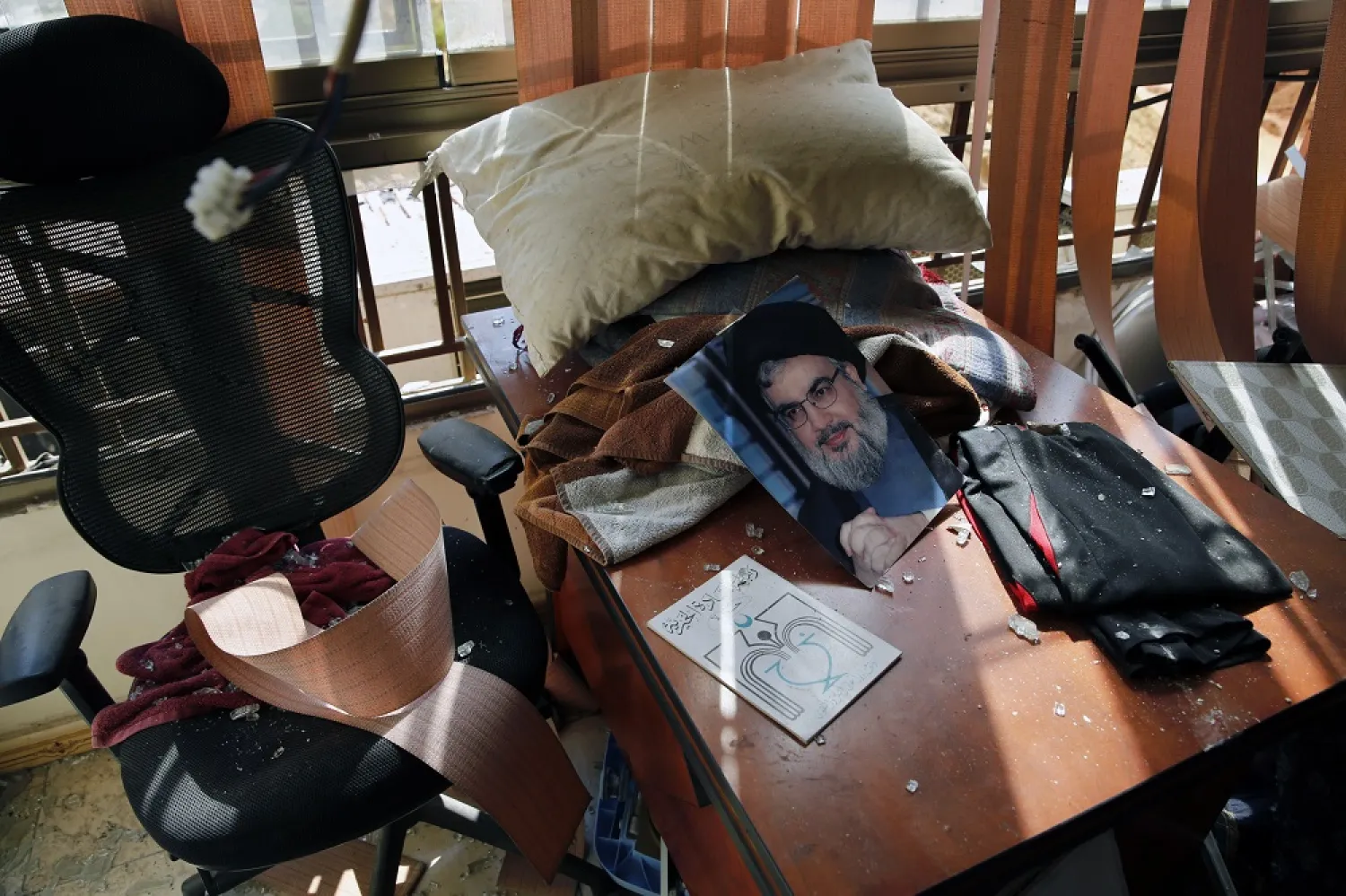 A poster of Hezbollah leader Hassan Nasrallah is seen amid other damage inside the media office in a stronghold of the party in a southern suburb of Beirut, Lebanon, August 25, 2019. (AP)