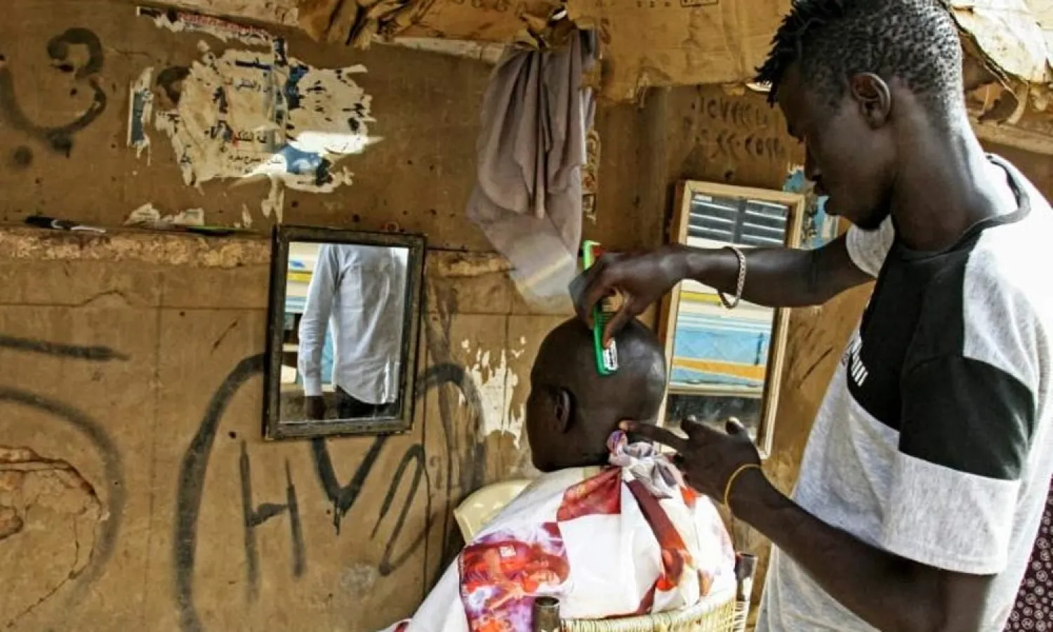 Young men are flocking to barbershops in Khartoum for modern hairstyles once banned under Omar al-Bashir's regime. (AFP)
