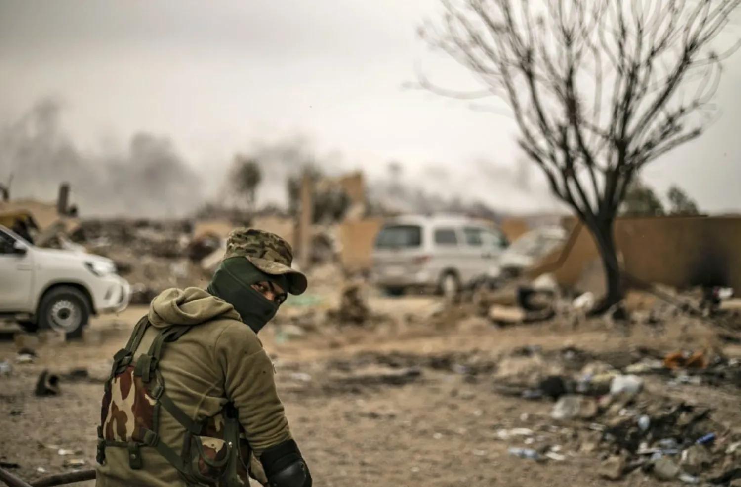 A member of the Syrian Democratic Forces (SDF) looks on while on watch duty in the village of Baghouz in Syria's eastern Deir Ezzor province near the Iraqi border on March 24, 2019, a day after ISIS group's "caliphate" was declared defeated by the US-backed Kurdish-led SDF. (Photo by Delil Souleiman/AFP/Getty Images)