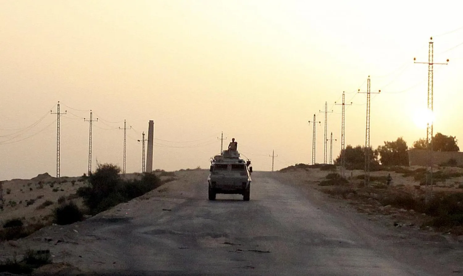 An Egyptian military vehicle is seen on the highway in northern Sinai, Egypt. (Reuters)