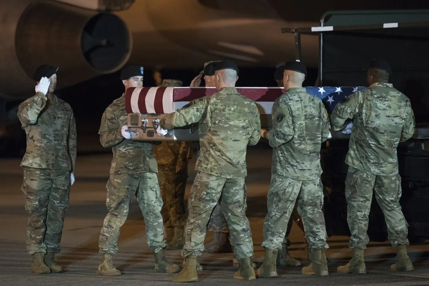An Army carry team moves a transfer case containing the remains of Sgt. 1st Class Elis Barreto Ortiz, 34, from Morovis, Puerto Rico, Saturday, Sept. 7, 2019, at Dover Air Force Base, Del. According to the Department of Defense, Ortiz was killed in action Sept. 5, when a vehicle-borne improvised explosive device detonated near his vehicle in Kabul, Afghanistan.  (AP Photo/Cliff Owen)