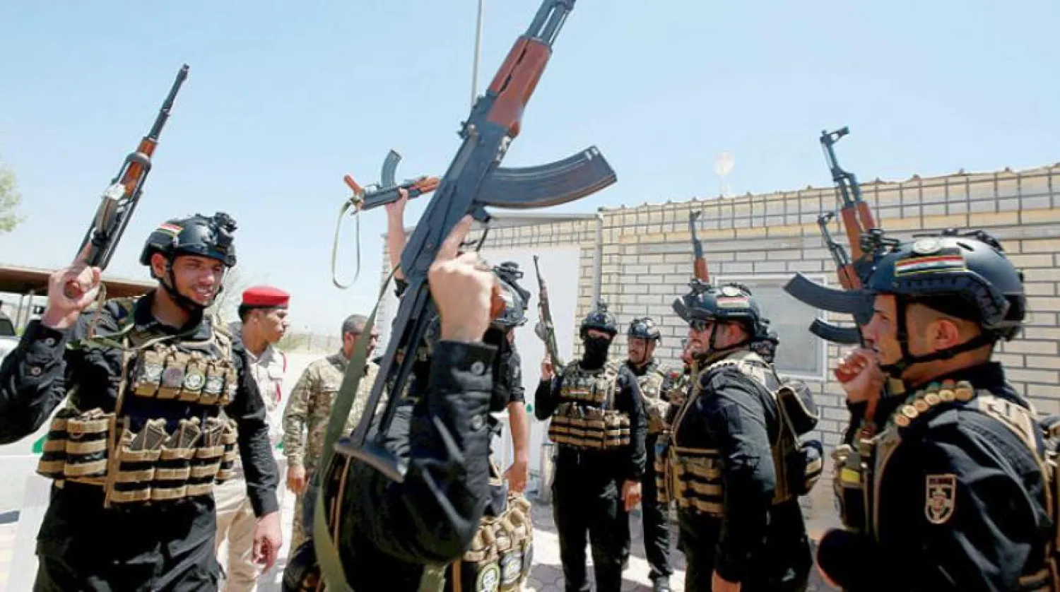 Necef’teki merkezlerinde güç gösterisi yapan Haşdi Şabi unsurları (EPA)