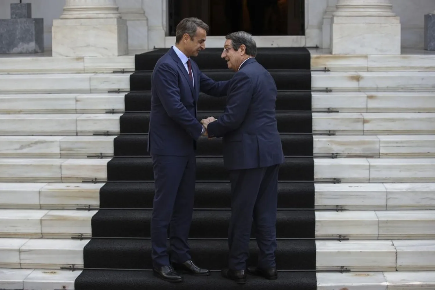 Greece's Prime Minister Kyriakos Mitsotakis (L) receives Cypriot President Nicos Anastasiades. (AP)