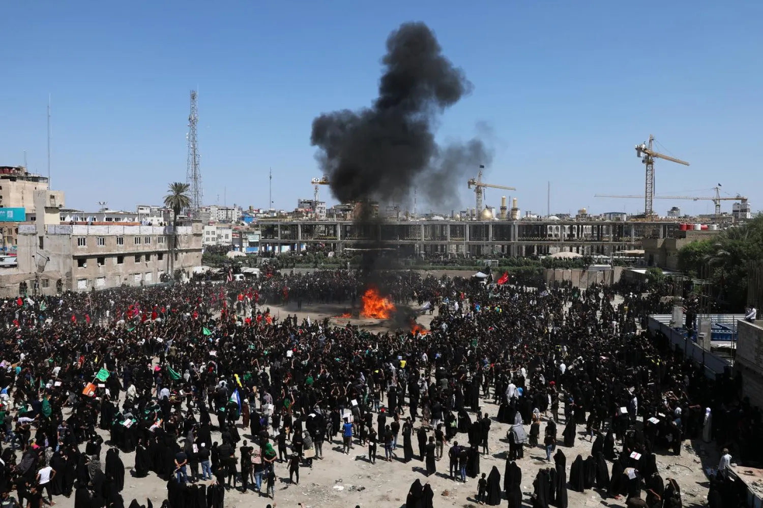 Iraqi Shiites burn a tent as they re-enact a scene from the 7th century battle of Karbala during a ceremony marking Ashura in Karbala, Iraq, September 10, 2019. (Reuters)
