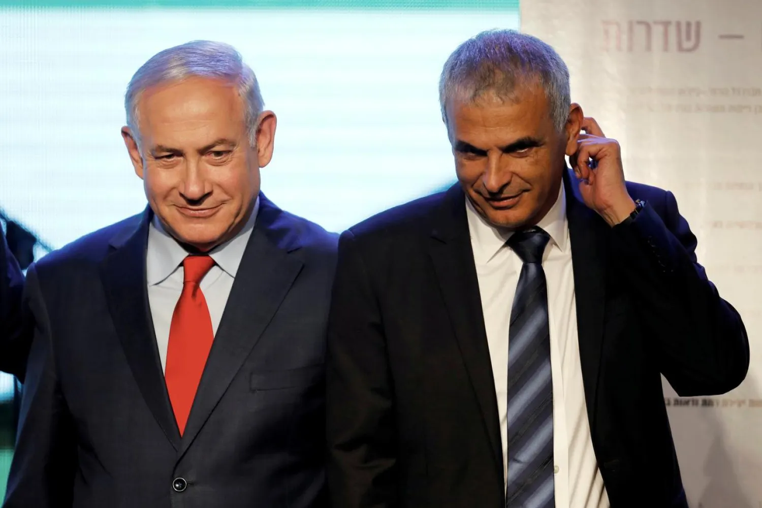 FILE PHOTO: Israeli Prime Minister Benjamin Netanyahu (L) and Finance Minister Moshe Kahlon attend a ceremony for the signing of a housing agreement in Sderot, Israel April 9, 2018. REUTERS/Amir Cohen/File Photo